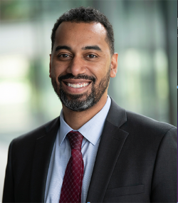 Headshot of Board of Education Zone 1 Member Iton Udosenata